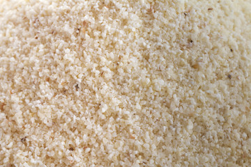 Macro shot of semolina, white wheat farina - healthy groats and cereal. Closeup.