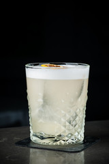 The bartender makes a cocktail of milk and ice. Macro, black background