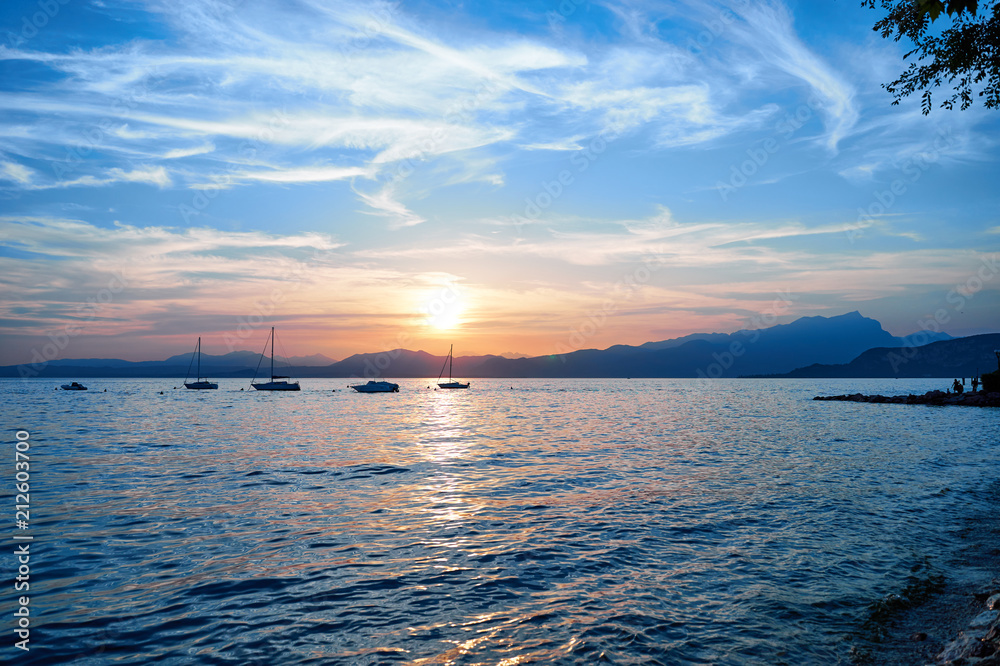 Sticker Spectacular sunset with beautiful light at City of Bardolino / Lake Garda in Italy