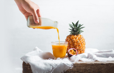 Pineapple and passion fruit juice In the White table background