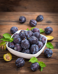Fresh organic plums in the bowl