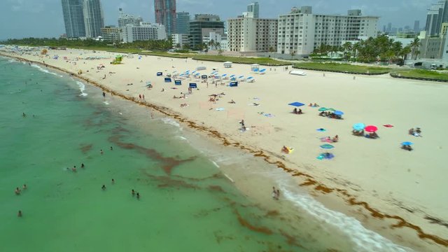 Drone flying over Miami Beach tourists 4k