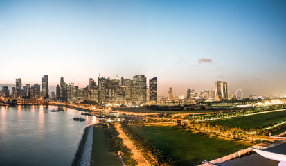Fototapeta premium singapore skyline in evening time, view from open deck of a cruise ship