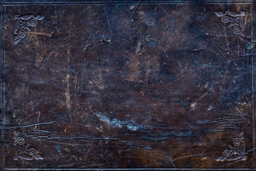 ancient damaged leather cover of an old book