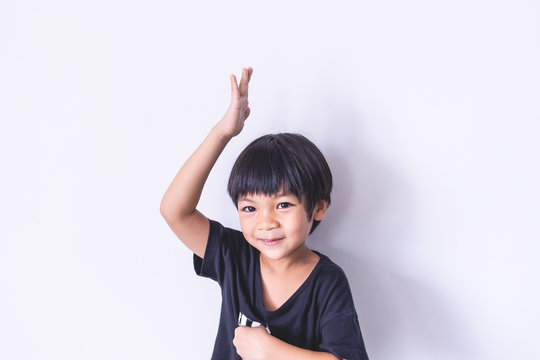 Happy Boy Raise His Hand Up On White Background