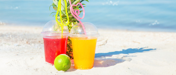 Bright Fresh healthy juices, fruit, pineapple on the background of the sea. Summer, rest, healthy lifestyle Copyspace Banner concept