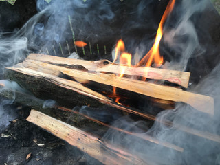 burning firewood in the grill