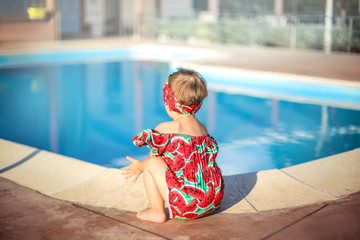 Cute baby playing next to a swimming pool © merla