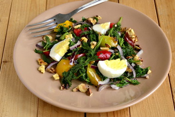 Salad with nettles, egg, sweet pepper, onion and  walnut