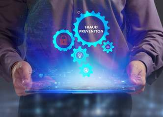 The concept of business, technology, the Internet and the network. A young entrepreneur working on a virtual screen of the future and sees the inscription: Fraud prevention