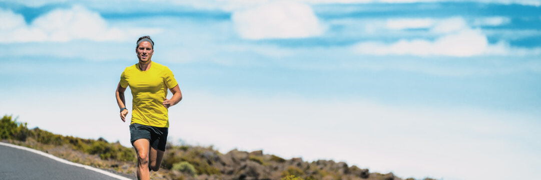 Runner Man Running On Triathlon Marathon Race Outdoors In Summer Heat. Male Athlete Training Cardio Running Long Distance Outside. Banner Panorama.