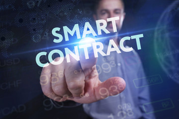 The concept of business, technology, the Internet and the network. A young entrepreneur working on a virtual screen of the future and sees the inscription: smart contract