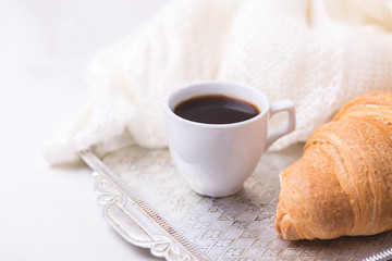 Coffee, plaid, croissant and books. Education concept.