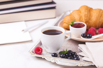 Coffee, croissant, plaid. Education concept. Selective focus