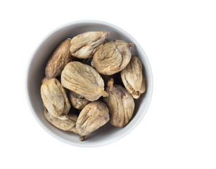 Full bowl of dried figs isolated on white background.