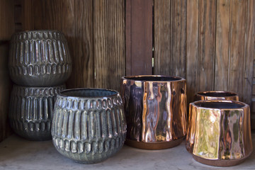 Empty Plant Pots on a Wooden Shelf