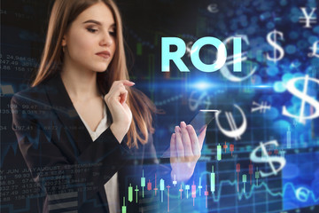 The concept of business, technology, the Internet and the network. A young entrepreneur working on a virtual screen of the future and sees the inscription: ROI