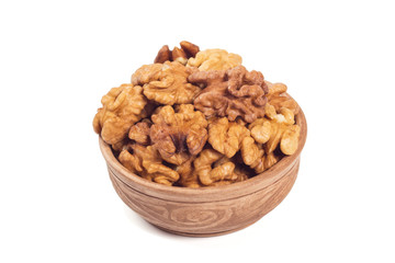 Walnut kernels in brown cup isolated on the white background