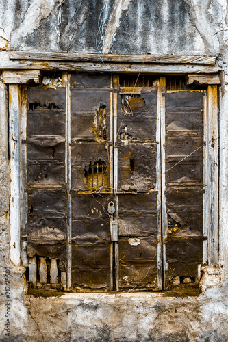 Wooden Door With Artistic Carved Designs Above And In The Side Of