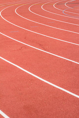 Fototapeta premium All-weather running track , orange and white lanes for running training