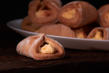 Cookies with cottage cheese - sochnik on wooden desk. Classic colors. Warm photo