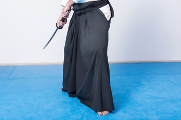 A man with katana on Iaido practice. Selective focus