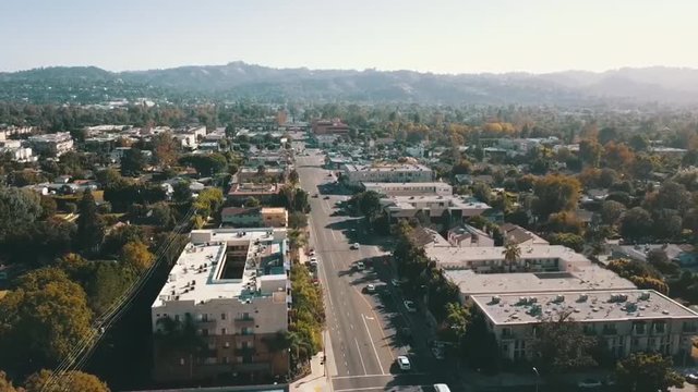 This is a drone shot taken in Valley Village, California. The street where cars are moving most fluently is Laurel Canyon Blvd.