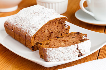Delicious homemade cake close-up. A few pieces of freshly baked raisin cake sprinkled with powdered sugar