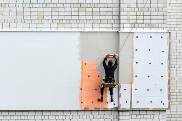 Industrial climber during winterization works.