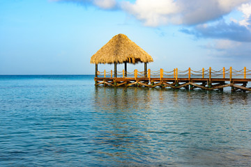 hot tropical day the Caribbean sea pier with pergola