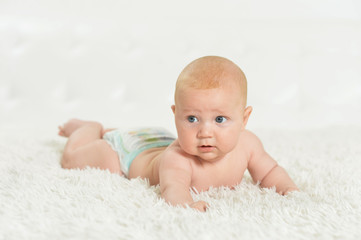 beautiful  baby boy on bed