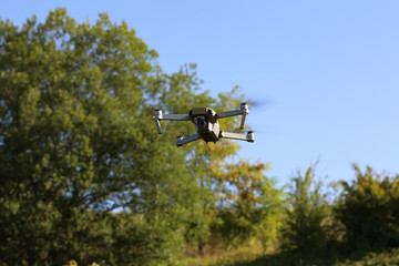 The drone flies over the forest