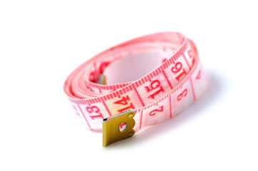 Red metric measuring tape isolated on white background