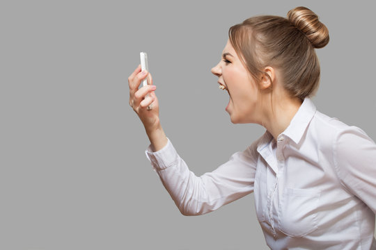 woman yelling into the phone
