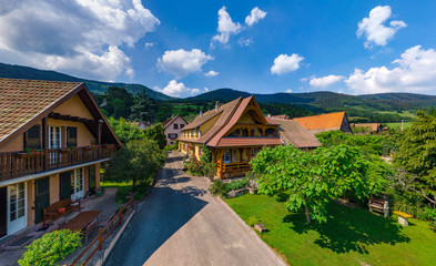 Fototapeta na wymiar Old but renovated village house in countryside aerial view