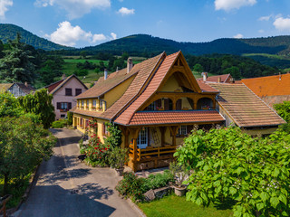 Old but renovated village house in countryside aerial view