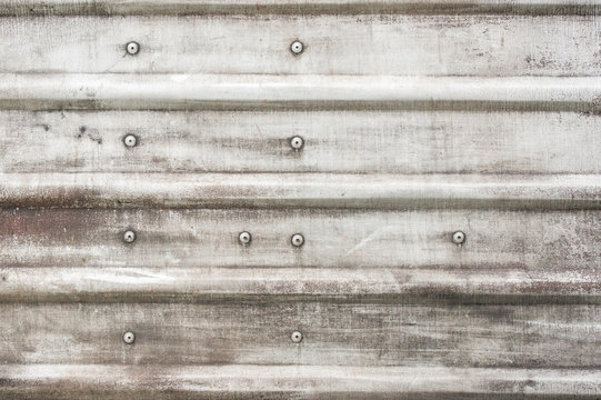 rusting silver metal panel background