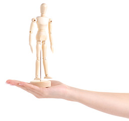 Wooden figure of a man in a hand on a white background isolation