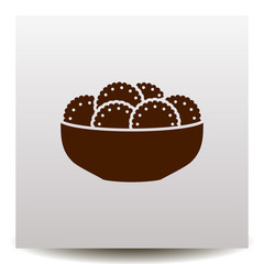 Biscuits or sweets on a plate vector icon.