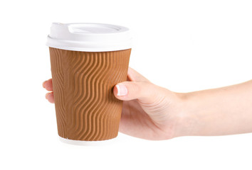 Cup of coffee with a lid in a hand on a white background isolation