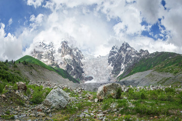 Fototapeta na wymiar Amazing mountain Caucasus landscape of peaks of mountains Tetnuldi, Gistola and Dzhangi-Tau and glacier Lardaad in Svaneti, Georgia. View on Snowy Rocky mountains and Adishi glacier.