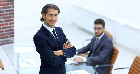 Fototapeta premium Portrait of businessman standing in office