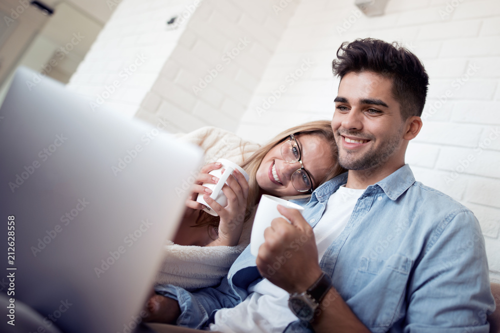 Sticker couple on internet with laptop