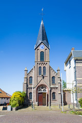 Fototapeta na wymiar Historic village church Martinus in Oudeschild on the Wadden island Texel in the Netherlands