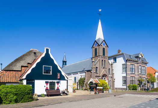 Village Oudeschild with Martinus church and trraditional gable  houses on the Wadden island Texel in the Netherlands