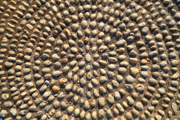 Detail of circular round pebble outdoor flooring