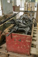 Drug and guns. This scene was staged to recreate an illegal warehouse, weapons are movie  props...