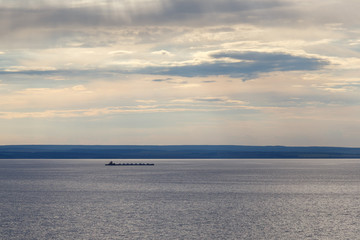 Fototapeta premium loaded barge floating on the river