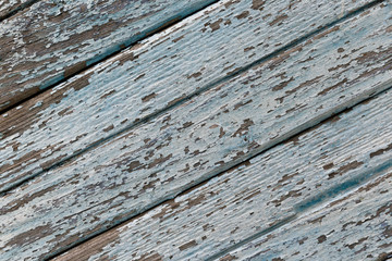 Old wooden background of boards with cracked and peeling paint