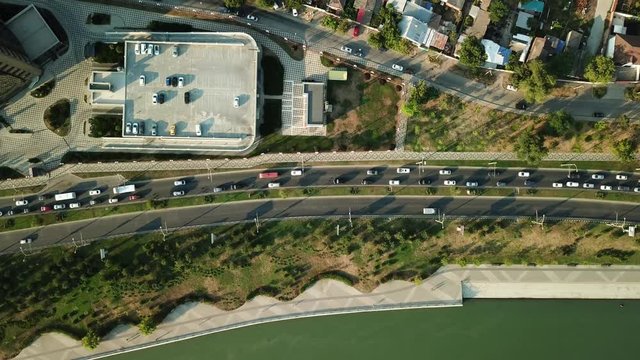 Aerial Drone Flight View of freeway busy city rush hour heavy traffic jam highway.  Aerial view of the vehicular intersection,  traffic at peak hour with cars on the road.